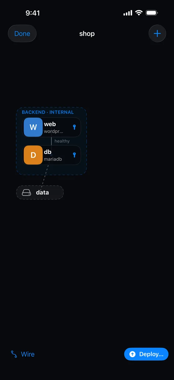 The canvas builder showing a web service, a database and a volume wired together